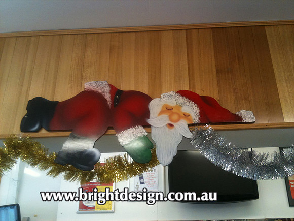 2- S-02 cg Lazy Santa Sleeping on Commercial Shop Counter - Outdoor displays no limited to the outdoors