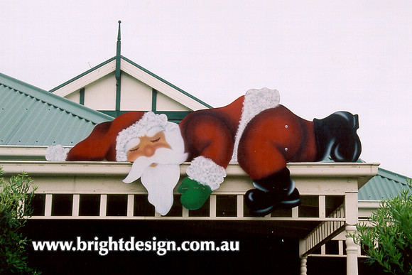 2- S-02 a Lazy Santa Sleeping at Home Roof
